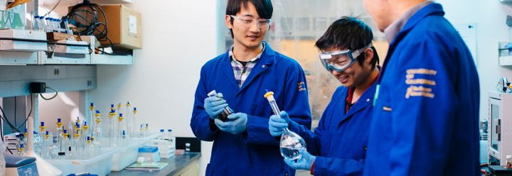 Chemist Shaowei Chen talks to students in lab, UCSC Science, photo credit Elena Zhukova 2019