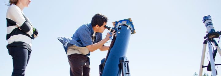 Astrophysics students look through telescope, photo credit Elena Zhukova for UC Santa Cruz 2012